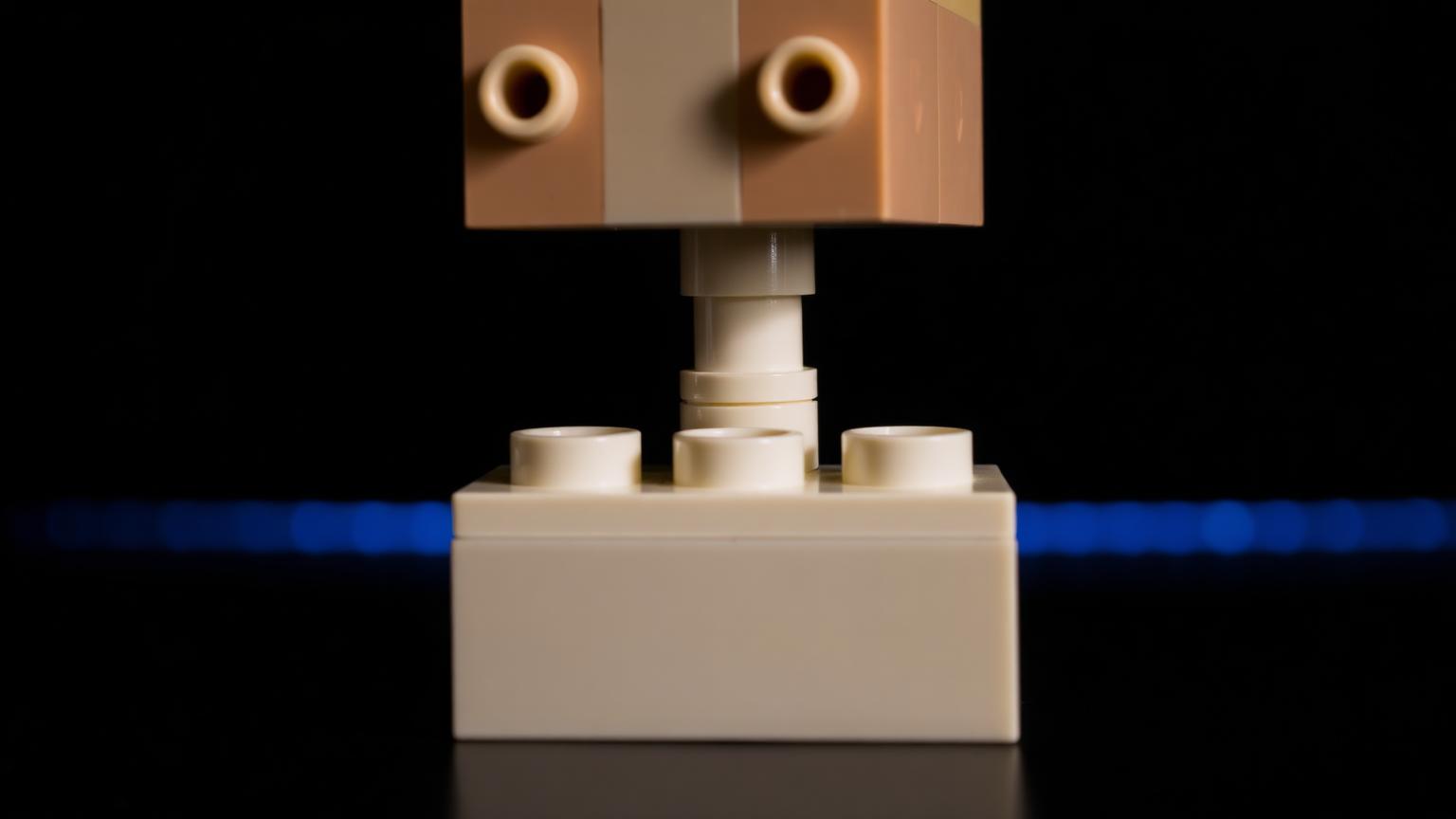 Close-up of an Insoon-style building brick pressed onto a standard LEGO brick showing stud-and-tube coupling